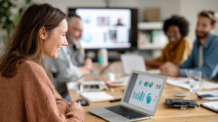 An online meeting in progress where a diverse team of freelancers shares their screens to discuss a project with visible charts and creative presentations on their laptops.