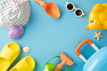 Colorful summer essentials arranged against a blue background, featuring toys, sandals, and sun hat
