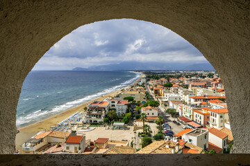 view of the beach and old town of Sperlonga in Italy. Scenic resort town village with nice sand beach and clear blue water. Famous tourist destination