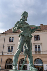 Monument to hussar with saber in uniform of Hungarian from era of Maria Theresa next to Sandor palace or Sandor palota in Budapest, Hungary. Vertical image