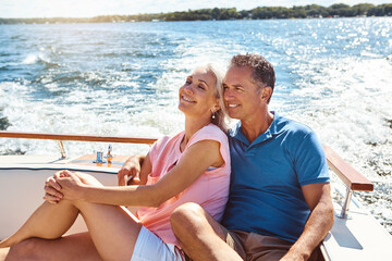 Boat, cruise and thinking with mature couple at sea together for holiday, getaway or vacation for anniversary. Idea, love or smile with happy man and woman on yacht for bonding, romance or voyage