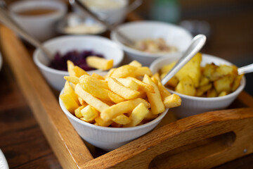 Crispy golden French  fries served on a clean white plate. Close-up shot with natural lighting, perfect for food blogs, restaurant menus, or fast food advertisements.