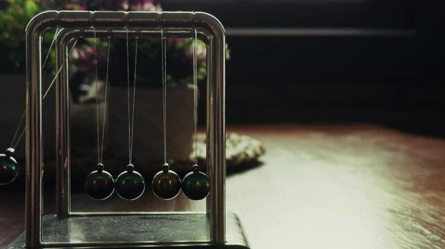 Newtons Cradle on a Wooden Table