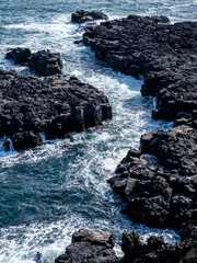 Water flowing between volcanic rock on the coast of Sn&aelig;fellsnes peninsula in Western Iceland