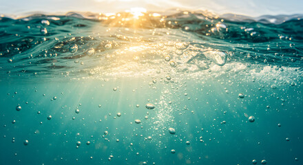 Sunlight Through Turquoise Water Illuminating Bubbles Underwater Scene in Clear Ocean Waters With a Tropical Atmosphere