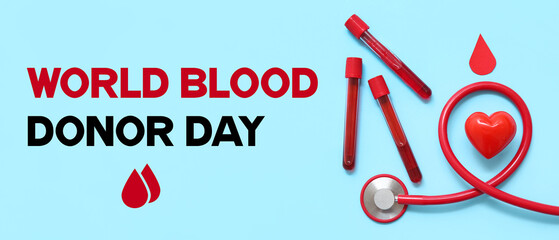 Heart, stethoscope and blood samples on blue background. World Blood Donor Day