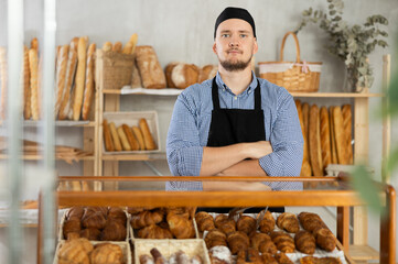 Authors bakery, fresh pastries from manufacturer. Man sells bread and pastries, waits for customers...