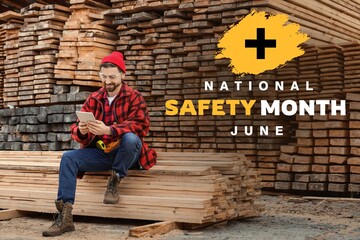 Male carpenter with tablet computer at sawmill. National Safety Month