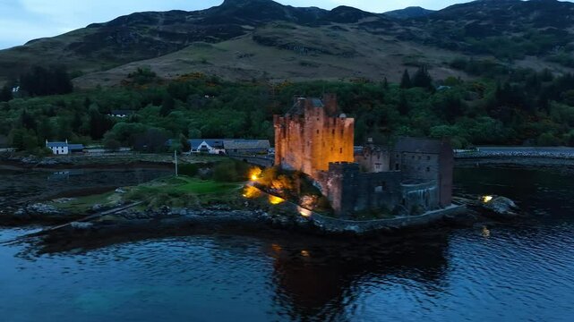Night over Eilean Donan Castle and Loch Duich from a drone, Isle of Skye, Highlands, Scotland, England