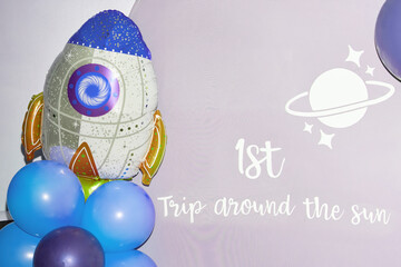 Space-Themed Birthday Backdrop with Rocket and Balloons
