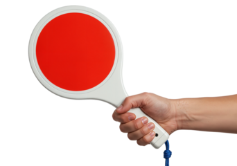 A hand grips a signal paddle featuring a red circle, set against a black backgroun, Useful for concepts involving communication, direction, or visual signaling in designs and presentations.