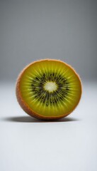 sliced kiwi fruit sitting on top of a white table