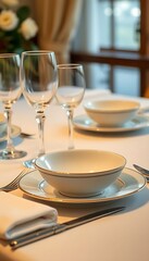 Fototapeta premium table set with white dishes and silverware