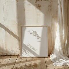 A white framed picture is on a wooden floor. The frame is empty. The picture is in a room with a window