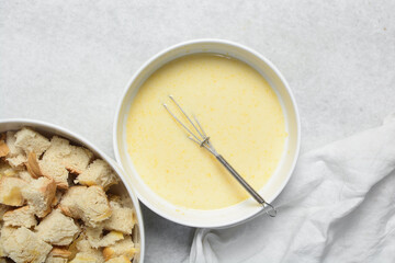 Overhead view of custard for making bread pudding, process of making bread pudding
