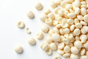 Scattered white beans on pristine white background, photography, culinary arts, still life