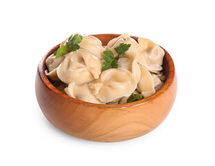 Wooden bowl with delicious boiled dumplings and parsley on white background