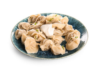 Plate of delicious boiled dumplings with sour cream and green onion on white background