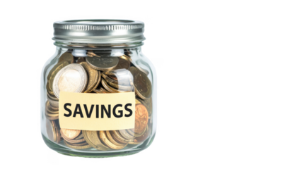 Clear Glass Jar Filled with Coins and Label for Savings Concept