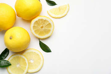 Fresh ripe lemons on white background, flat lay. Space for text