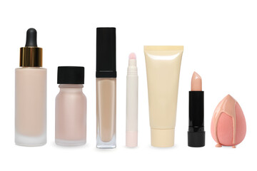 Liquid foundation, concealers isolated and sponge on white, set