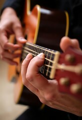 Fototapeta premium close up of a person playing a guitar
