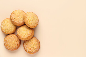Many sweet cookies on beige background