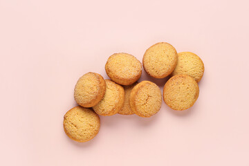 Many sweet cookies on pink background