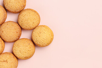 Many sweet cookies on pink background