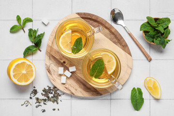 Composition with fresh mint tea on light background, top view
