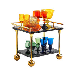 A Chic Modern Bar Cart with Black Marble and Gold Accents Isolated on Transparent Background