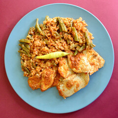 Peri Peri chicken with brown rice and green beans. 