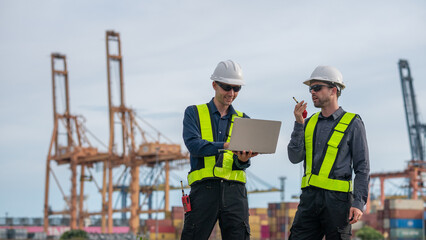 Industrial engineer workers operations marine port cranes loading and unloading of cargo ships...