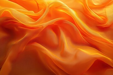 Obraz premium Radiant orange fabric folds in soft, flowing texture.