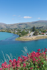 Central Otago town of Cromwell on bend in turquoise  Clutha River in Central Otago New Zealand.