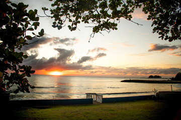 South Atlantic sunrise on land facing the sea on a secluded beach within land overlooking the...