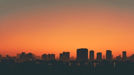 Obraz premium City skyline silhouette against a warm dusk sky, urban simplicity meets serene twilight. 