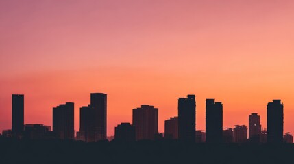 Obraz premium City skyline silhouette against a warm dusk sky, urban simplicity meets serene twilight. 