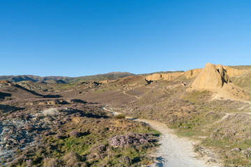 Bannockburn sluicing, and area of countryside outside Cromwell resulting from historic gold sluicing now attracts tourists to walk the tracks and trails through the altered landscape.