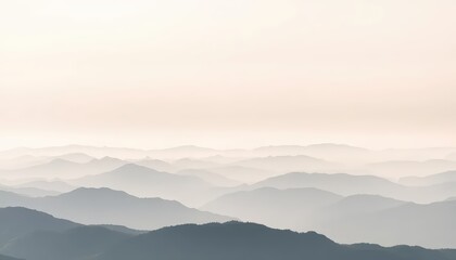 Obraz premium A serene, distant view of undulating mountain ranges under a soft