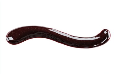 Dark, glossy, viscous liquid in a smooth, flowing, wavy line against a white background
