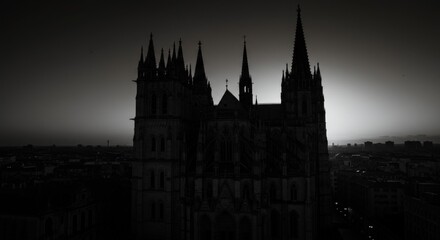 Obraz premium Gothic Cathedral Silhouette at Sunset