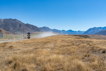Surrounded by mountain ranges the extreme arid dry farming fields in the Ahuriri conservation valley area  in Canterbury NZ