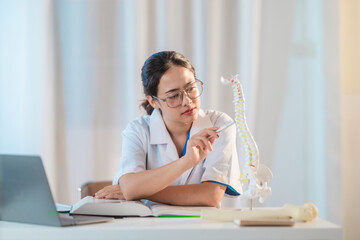  Asian Medical Student Studying Anatomical Model.