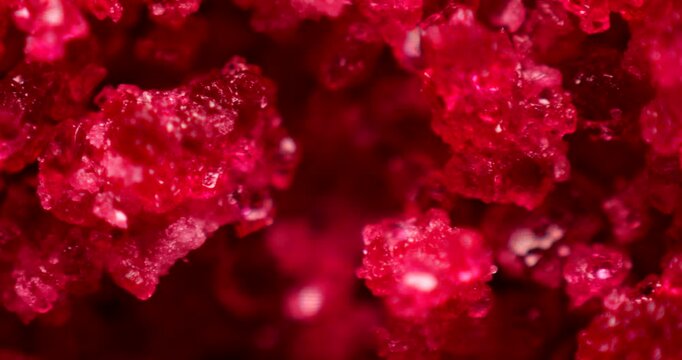 Close-up of hygroscopic cobalt(II) chloride hexahydrate demonstrating color change from blue to pink depending on humidity levels. Science experiment concept.