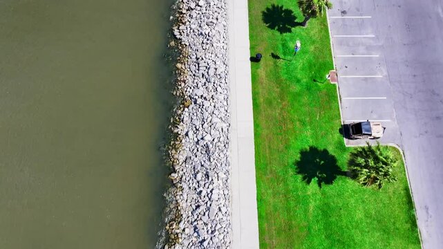 overhead aerial footage along the banks of  Lake Pontchartrain at Lakeshore Park in New Orleans Louisiana USA