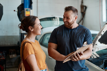 Woman, mechanic and sign agreement in auto repair shop, invoice and service for car maintenance....