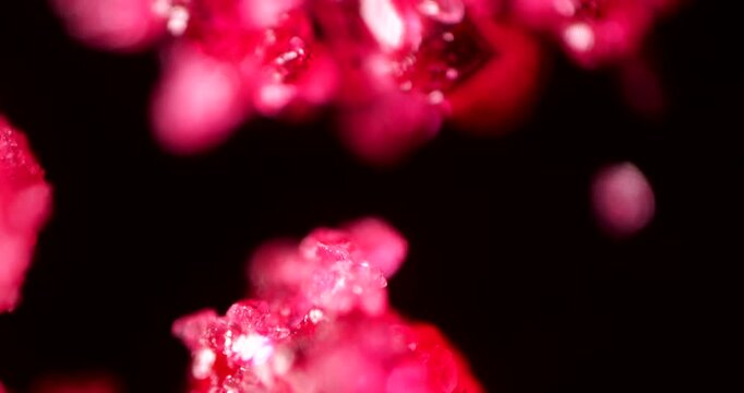 Ammonium dichromate crystals under microscope in 4K detail. Extreme close-up reveals vibrant orange crystalline structures with geometric patterns and reflective surfaces