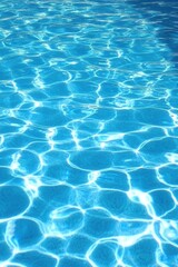 Obraz premium Swimming Pool Water Surface with Caustic Light Reflections Abstract Background Summer Vacation Holiday Concept