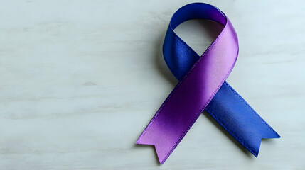 Elegant awareness ribbon featuring purple and blue hues on a clean white surface